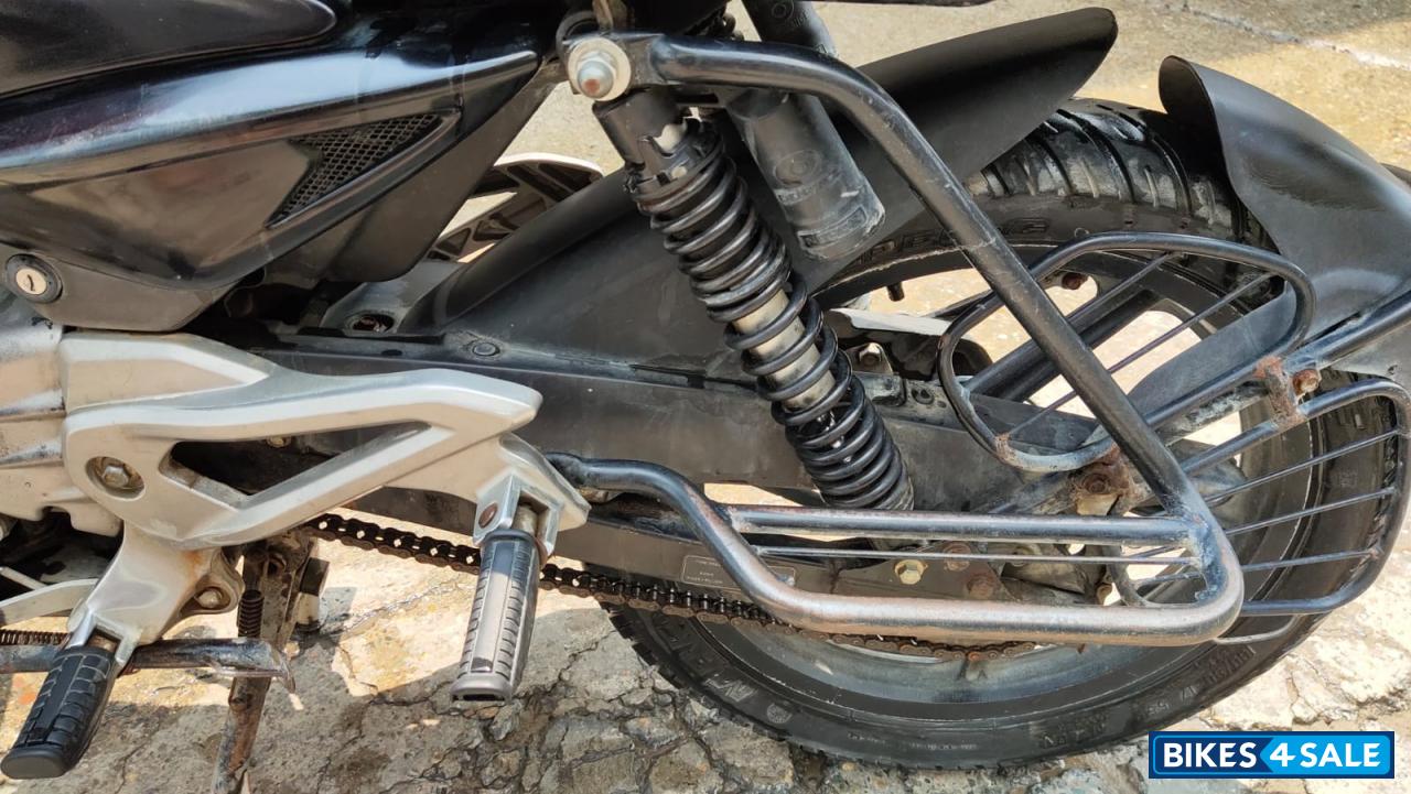 Red-black Bajaj Pulsar 135LS