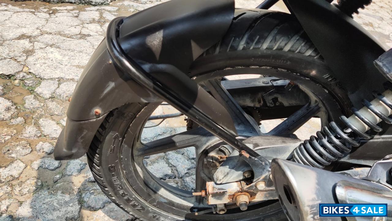 Red-black Bajaj Pulsar 135LS