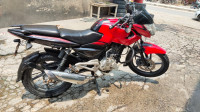 Red-black Bajaj Pulsar 135LS