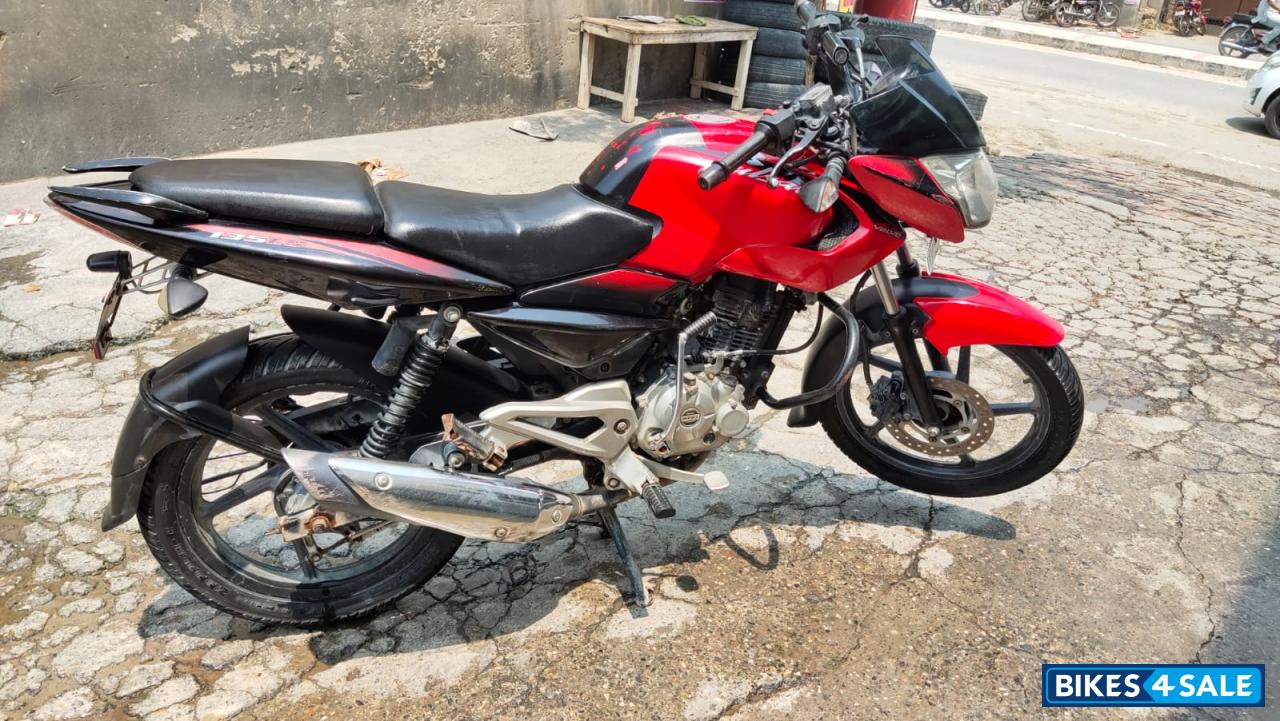 Red-black Bajaj Pulsar 135LS