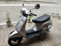 Silver Vespa VX 125