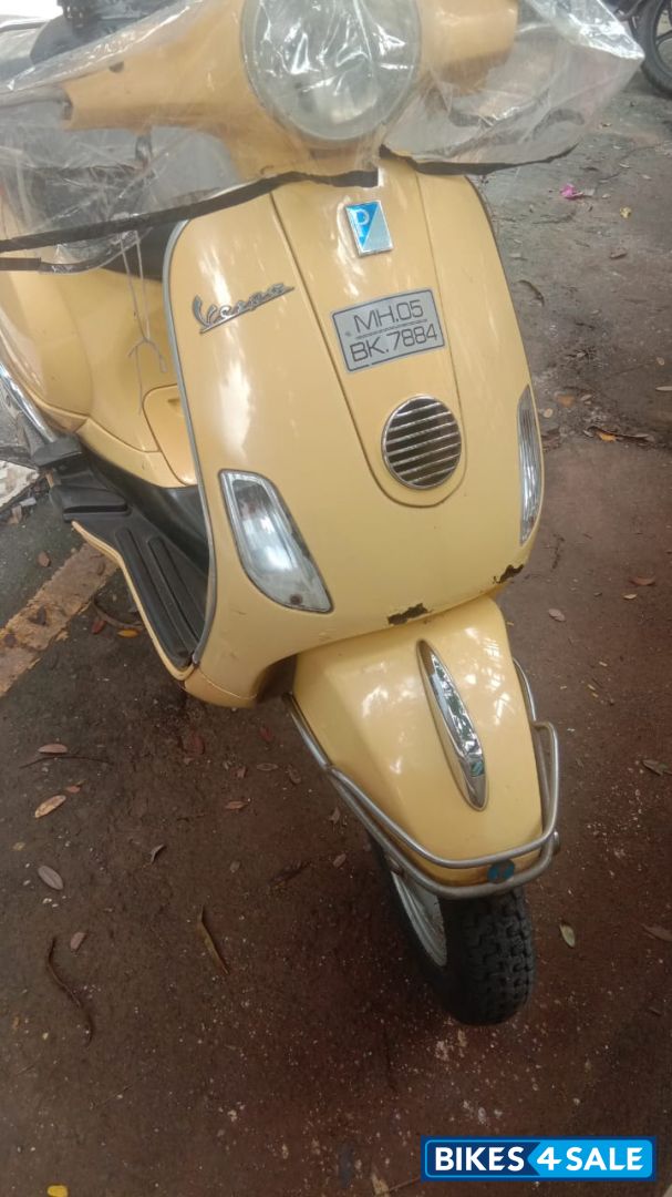 Yellow Vespa 125