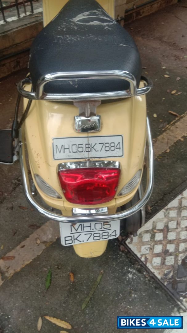 Yellow Vespa 125