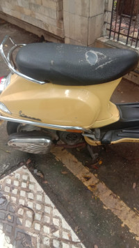 Yellow Vespa 125