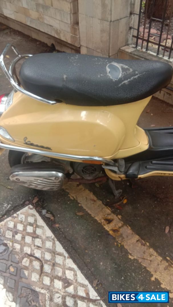 Yellow Vespa 125