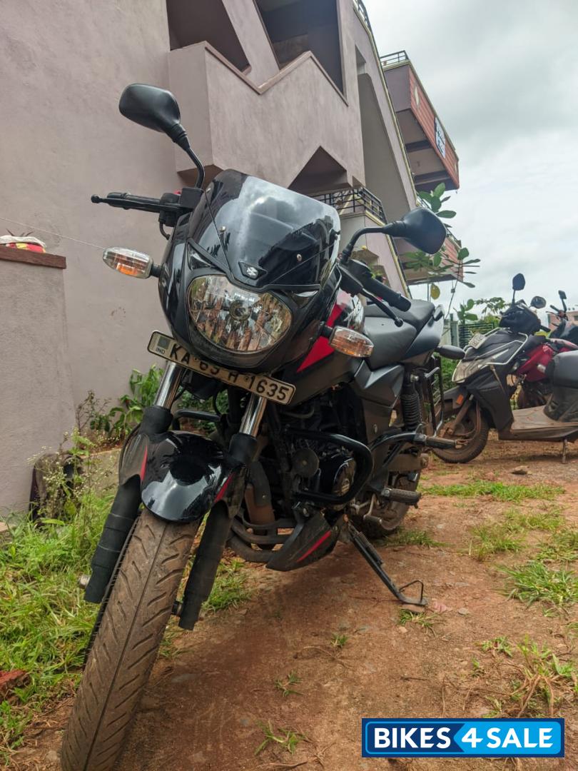 Black And Red Bajaj Pulsar 150 Twin Disc