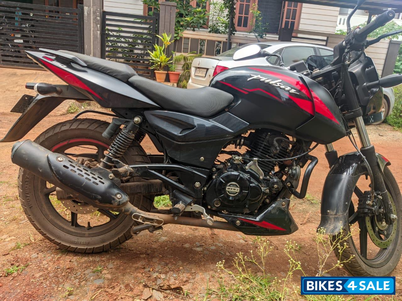 Black And Red Bajaj Pulsar 150 Twin Disc