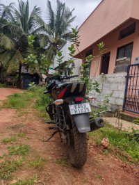 Black And Red Bajaj Pulsar 150 Twin Disc