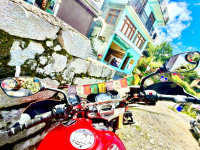 Red And White Mahindra Mojo UT 300