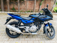 Blue And Black Bajaj Pulsar 220 DTSi