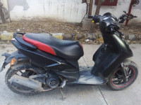 Black Aprilia SR 150