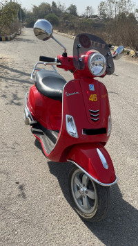 Orange Vespa VXL 150