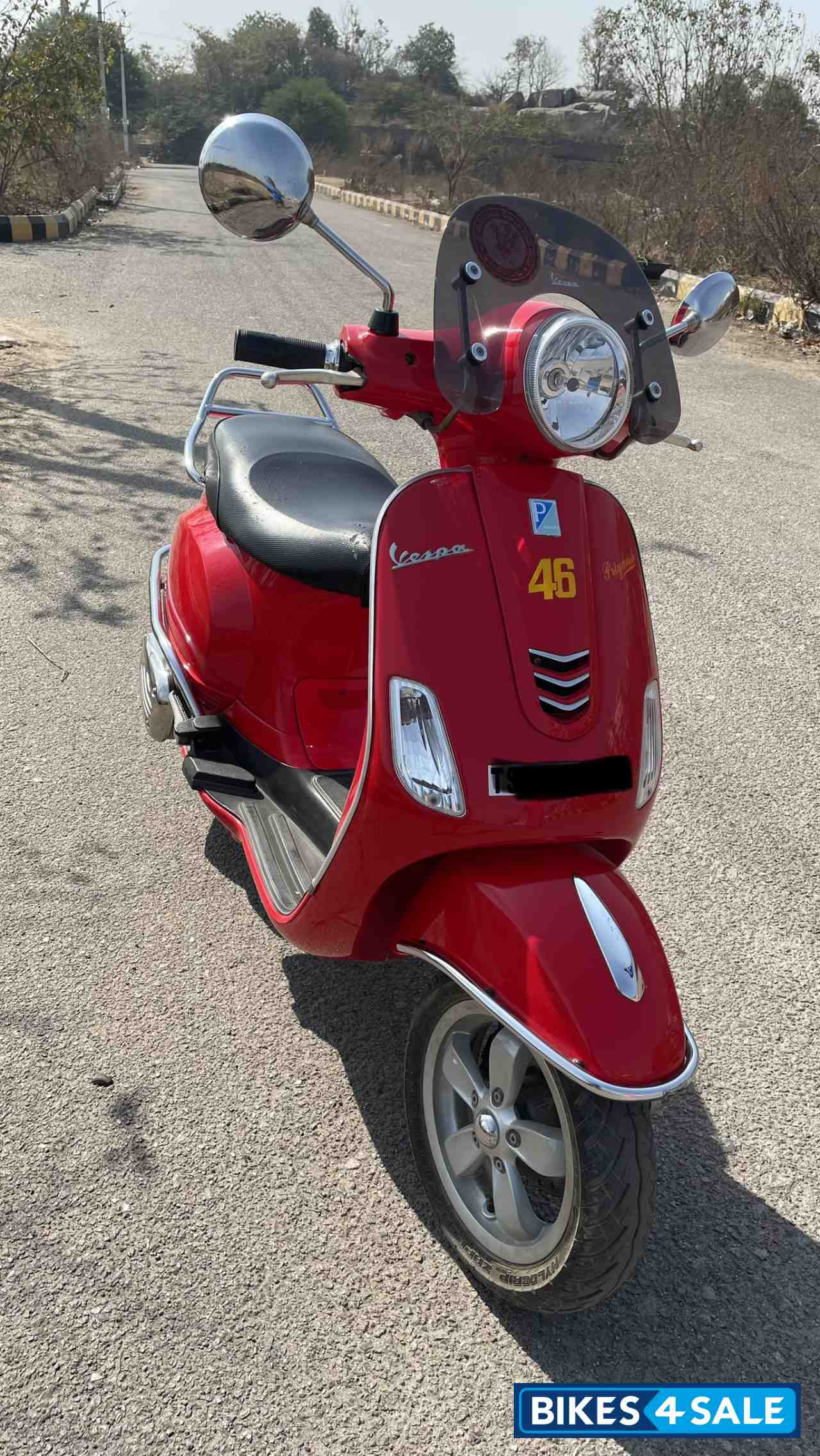 Orange Vespa VXL 150