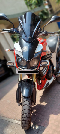 Red-white Mahindra Mojo