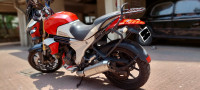 Red-white Mahindra Mojo