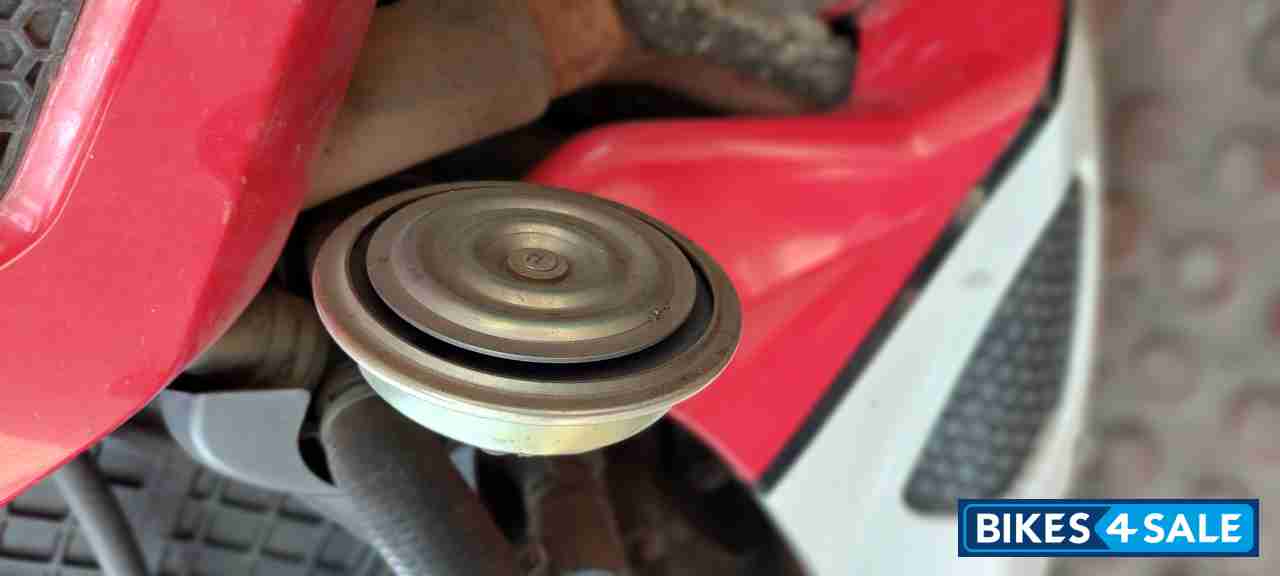 Red-white Mahindra Mojo