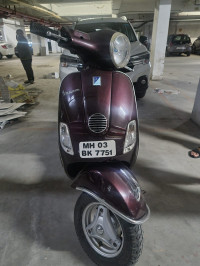 Maroon Vespa LX 125