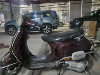 Maroon Vespa LX 125