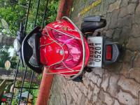 Red Yamaha Fascino 125 Fi Hybrid