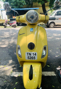 Yellow Vespa VXL 150
