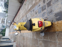 Yellow Vespa LX 125