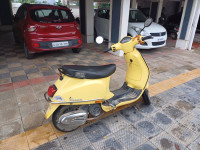 Yellow Vespa LX 125