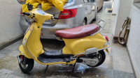 Yellow Vespa VX 125