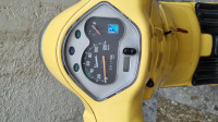 Yellow Vespa VX 125
