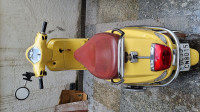Yellow Vespa VX 125