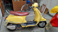 Yellow Vespa VX 125