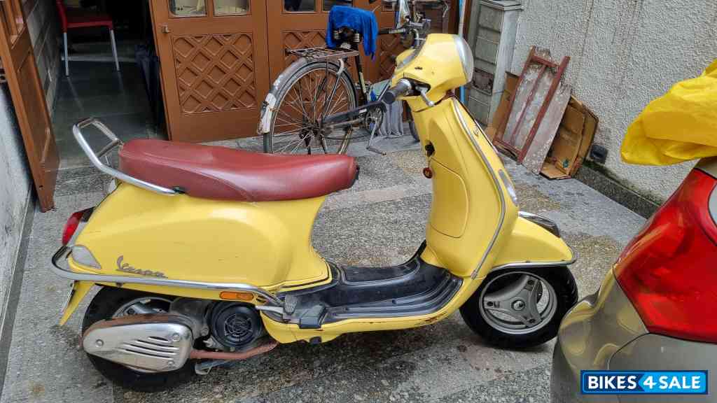 Yellow Vespa VX 125