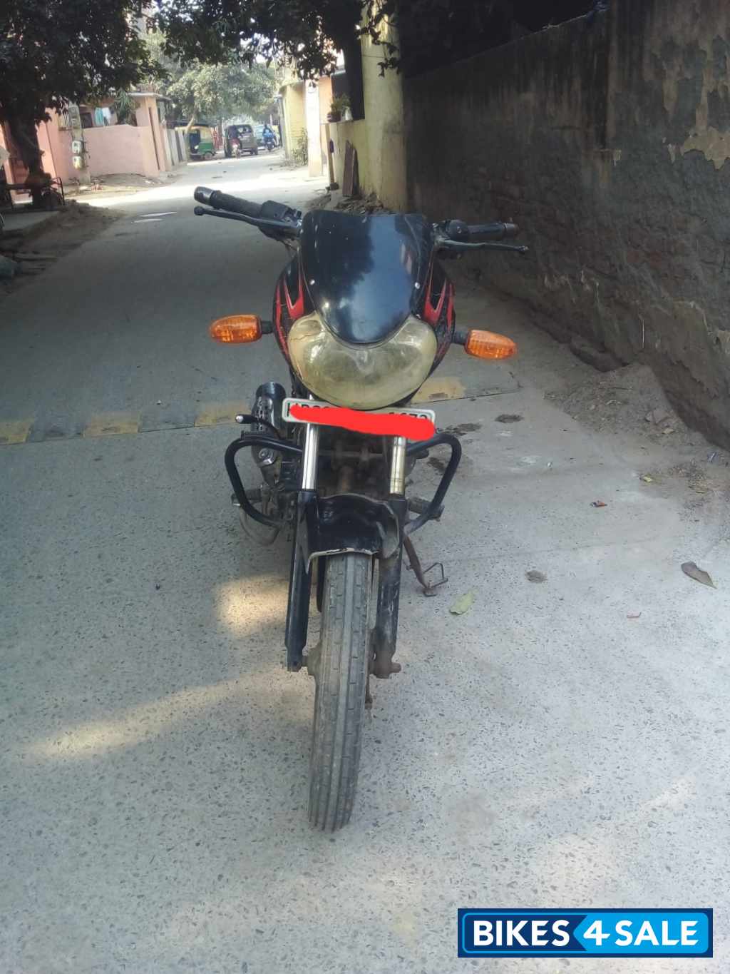 Black-red Bajaj Discover 125