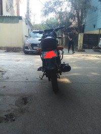Black-red Bajaj Discover 125