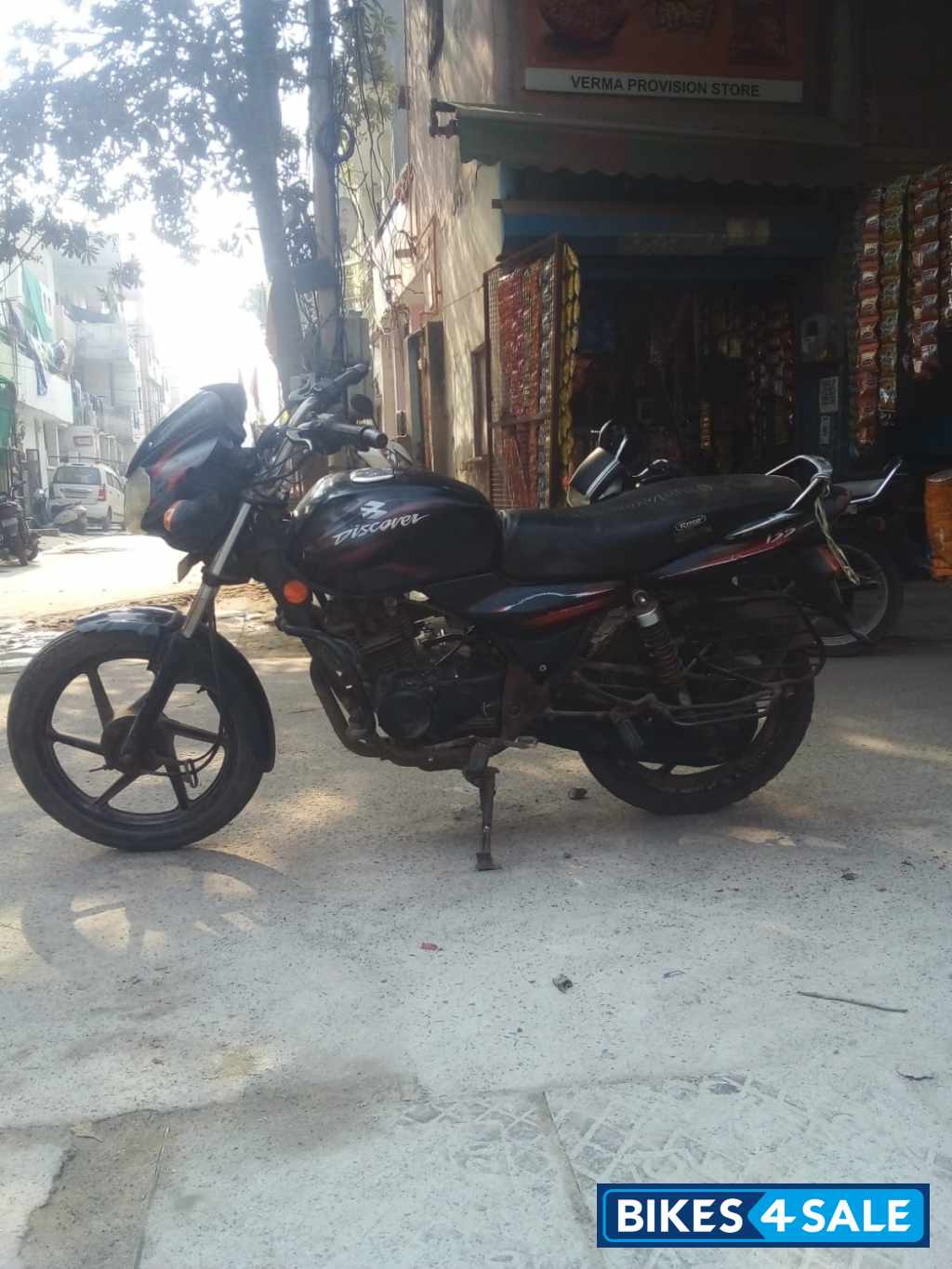 Black-red Bajaj Discover 125
