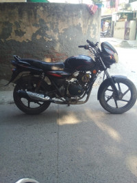 Black-red Bajaj Discover 125