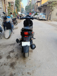 Black Aprilia SR 150