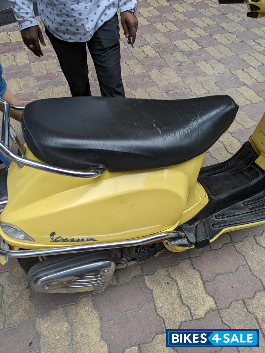 Yellow Vespa VX 125