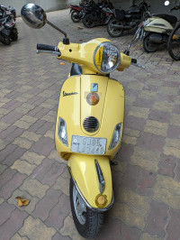 Yellow Vespa VX 125