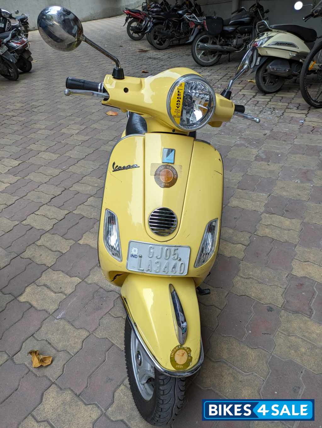 Yellow Vespa VX 125