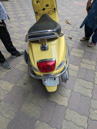 Yellow Vespa VX 125
