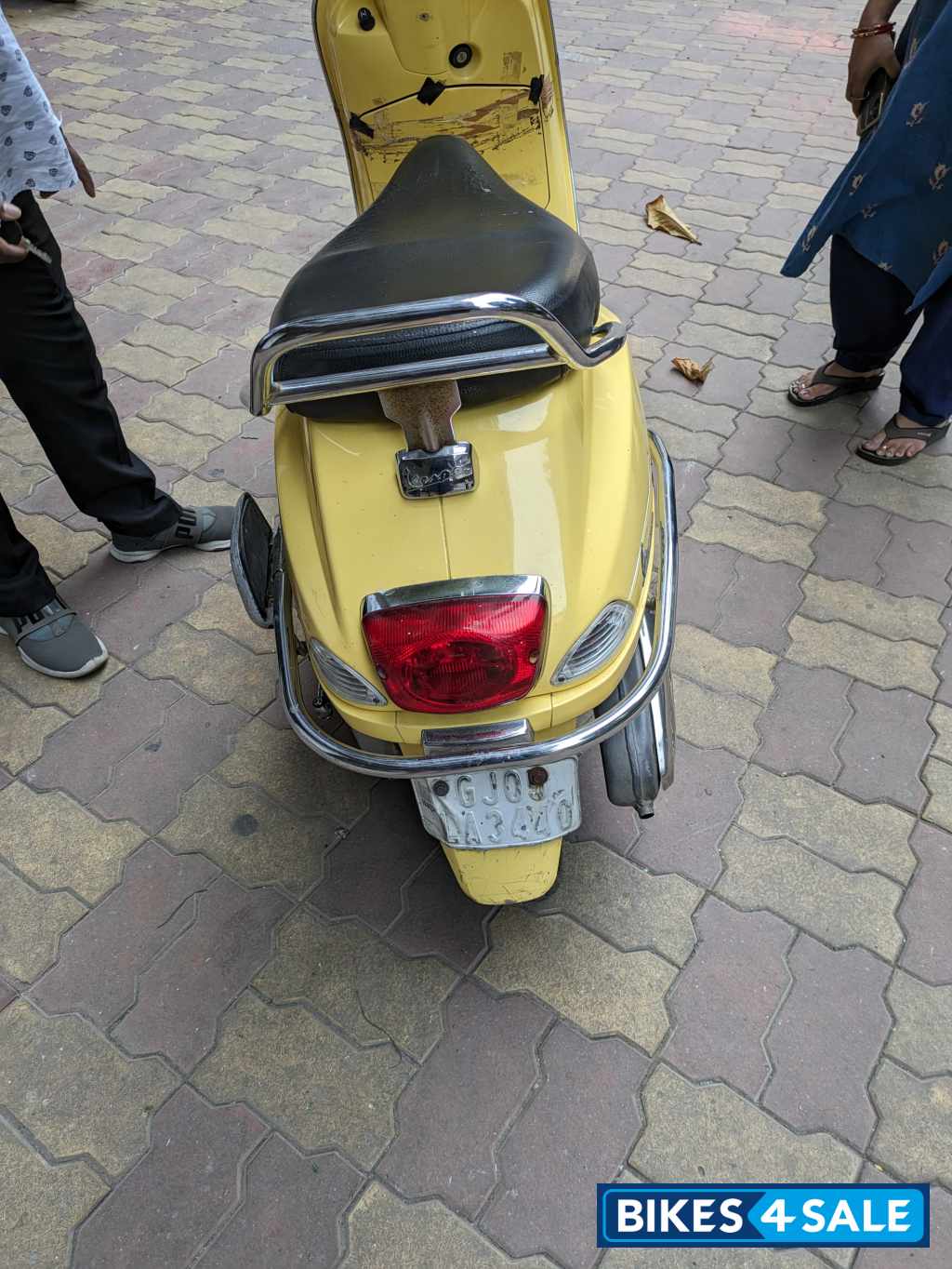 Yellow Vespa VX 125