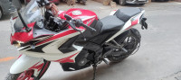 Red And White Bajaj Pulsar RS 200 ABS