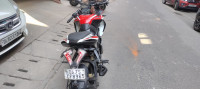 Red And White Bajaj Pulsar RS 200 ABS
