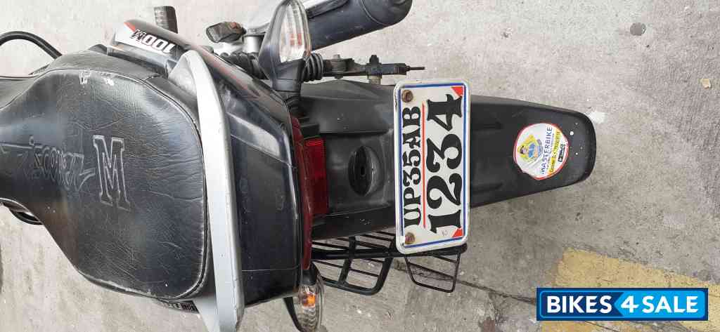 Black Red Bajaj Discover 100M