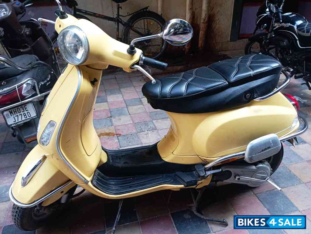 Yellow Vespa 125