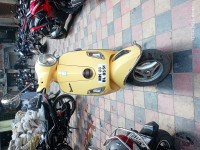 Yellow Vespa 125