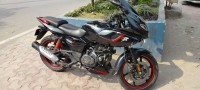 Shiny Black And Red Bajaj Pulsar 180F Neon BS6