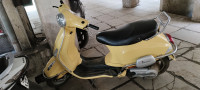 Yellow Vespa VXL 125