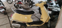 Yellow Vespa VXL 125
