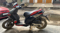 Black Aprilia SR 150 Carbon